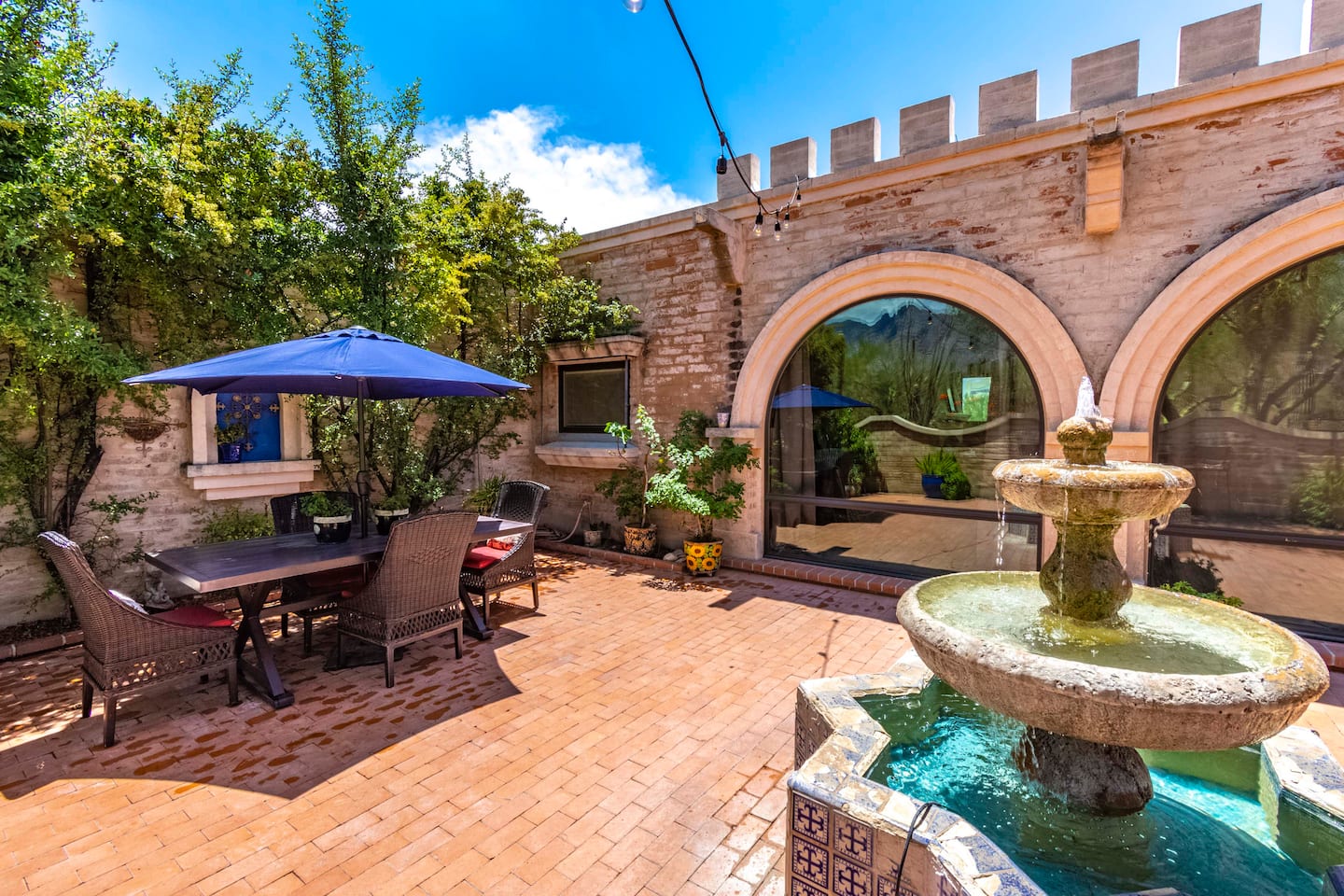 Private courtyard patio with a tiled fountain at the Azul Courtyard Suite